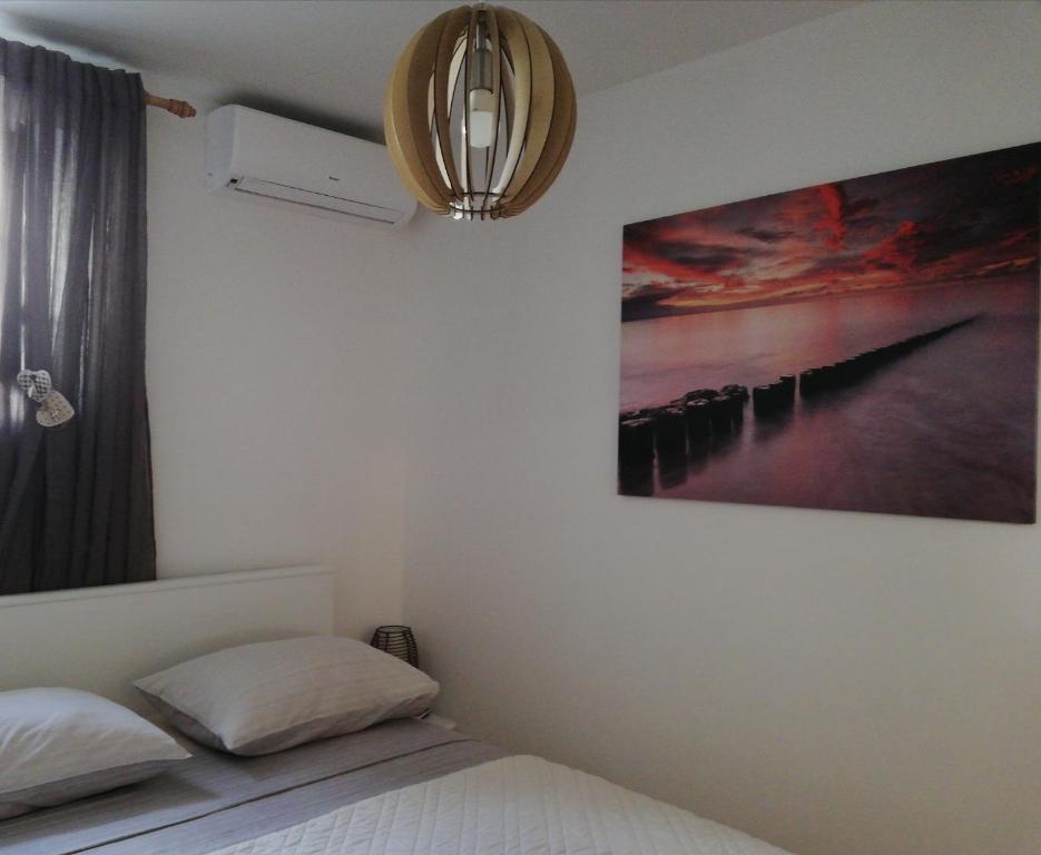Postel nebo postele na pokoji v ubytování Studio Apartman Lenka
