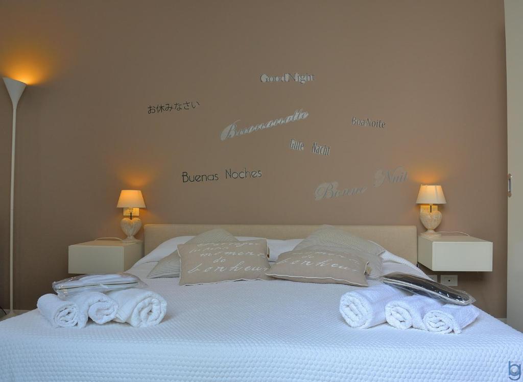 a bedroom with a bed with towels on it at B&b Mondello Resort in Palermo