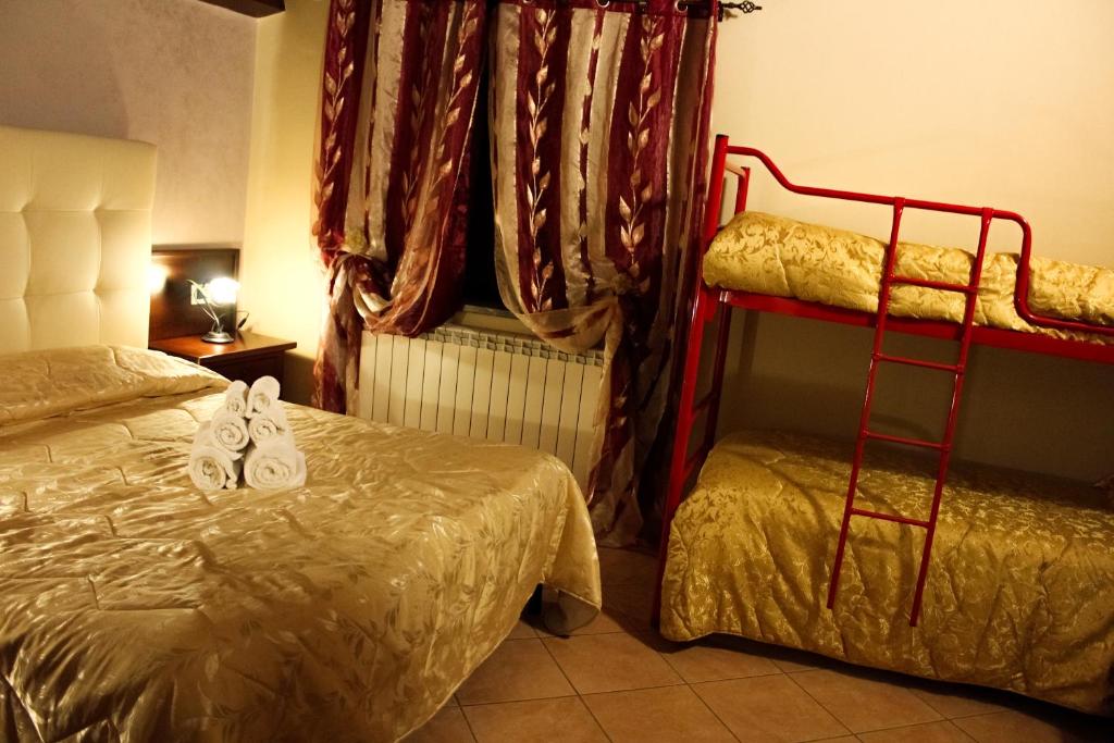 Postel nebo postele na pokoji v ubytování Agriturismo Aria Fina