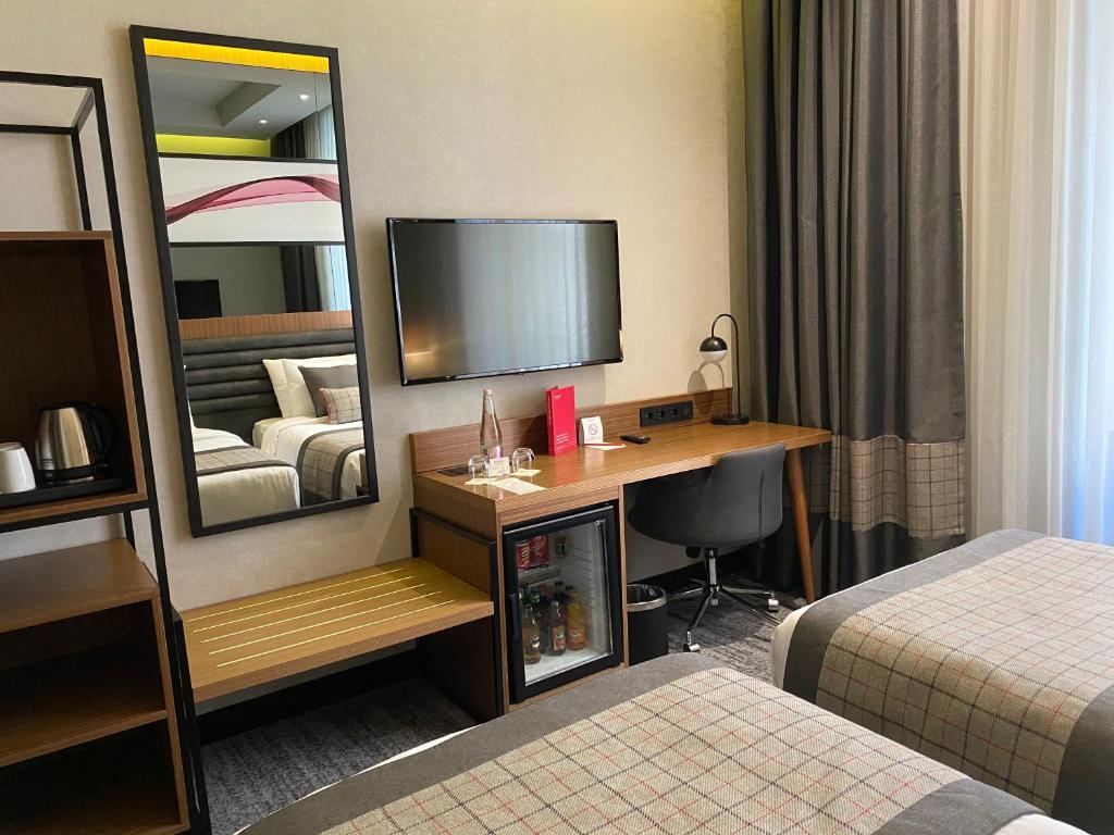 Postel nebo postele na pokoji v ubytování Ramada by Wyndham Budapest City Center