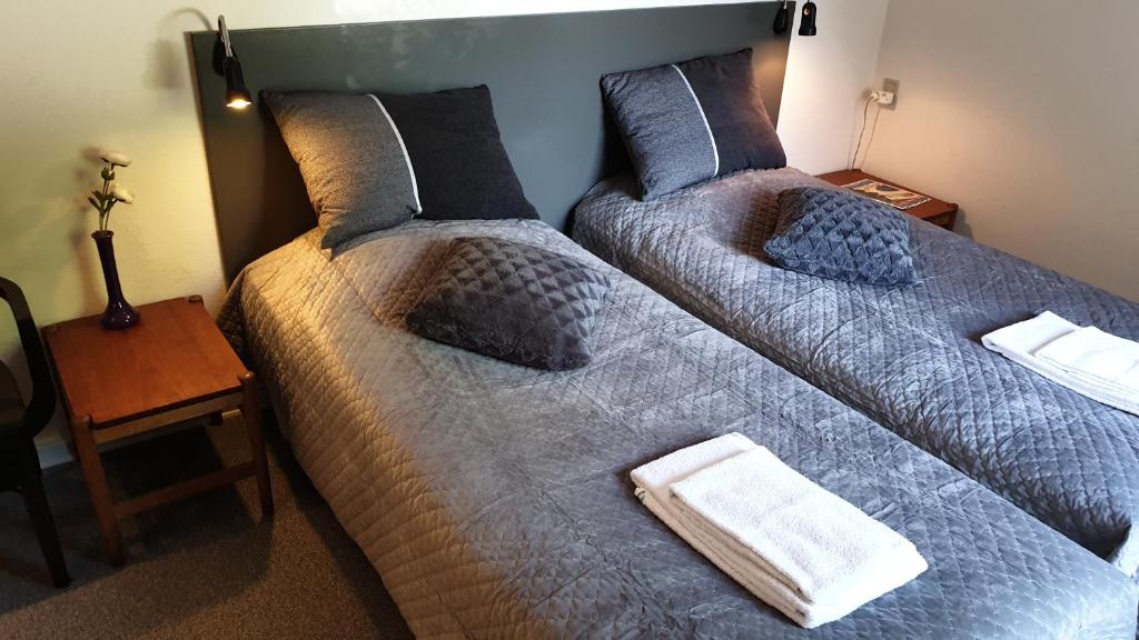 Postel nebo postele na pokoji v ubytování Hotel Aabenraa