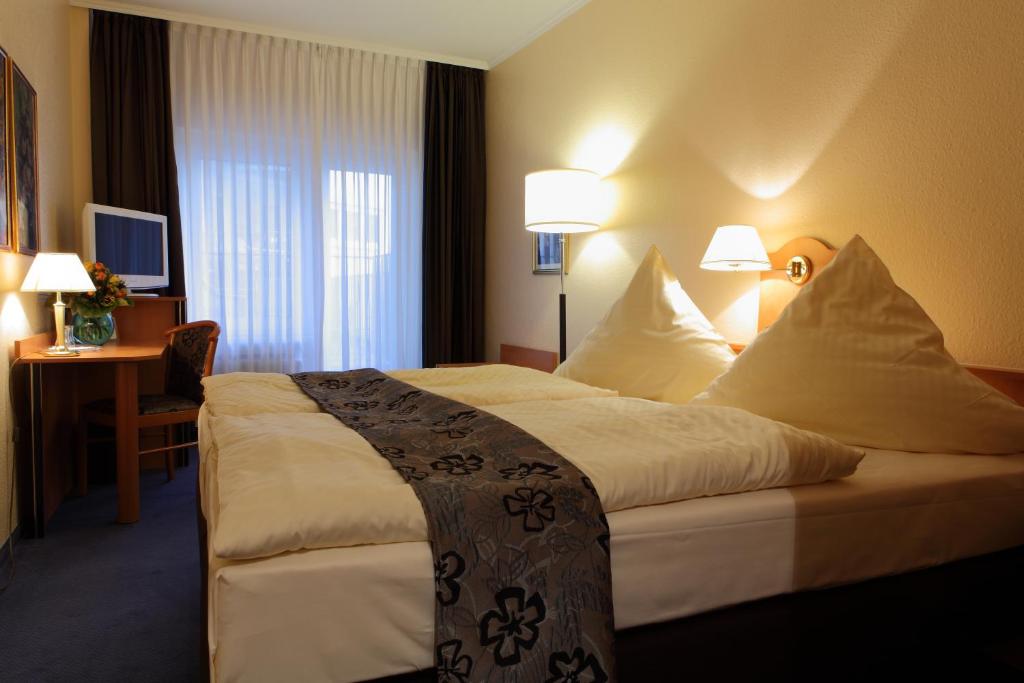 Postel nebo postele na pokoji v ubytování Hotel Boulevard