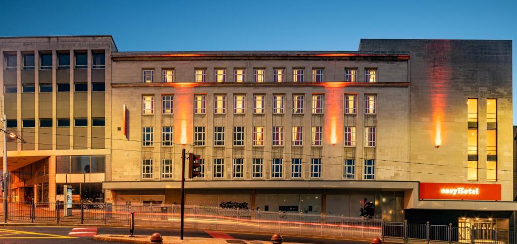 
a large building with a clock on the side of it at easyHotel Sheffield in Sheffield
