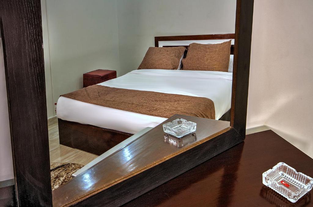 A bed or beds in a room at TuT Pyramids View