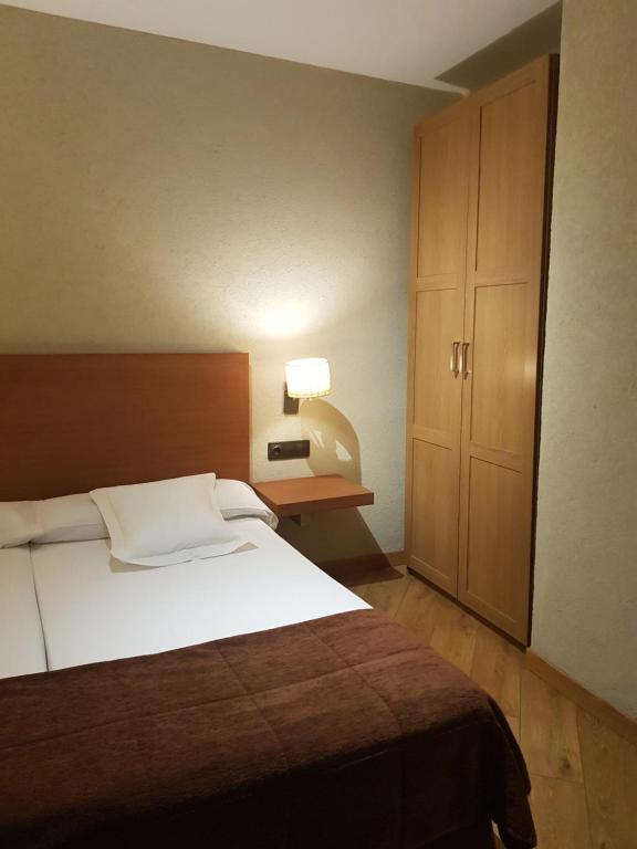 Postel nebo postele na pokoji v ubytování Hotel Las Leyendas