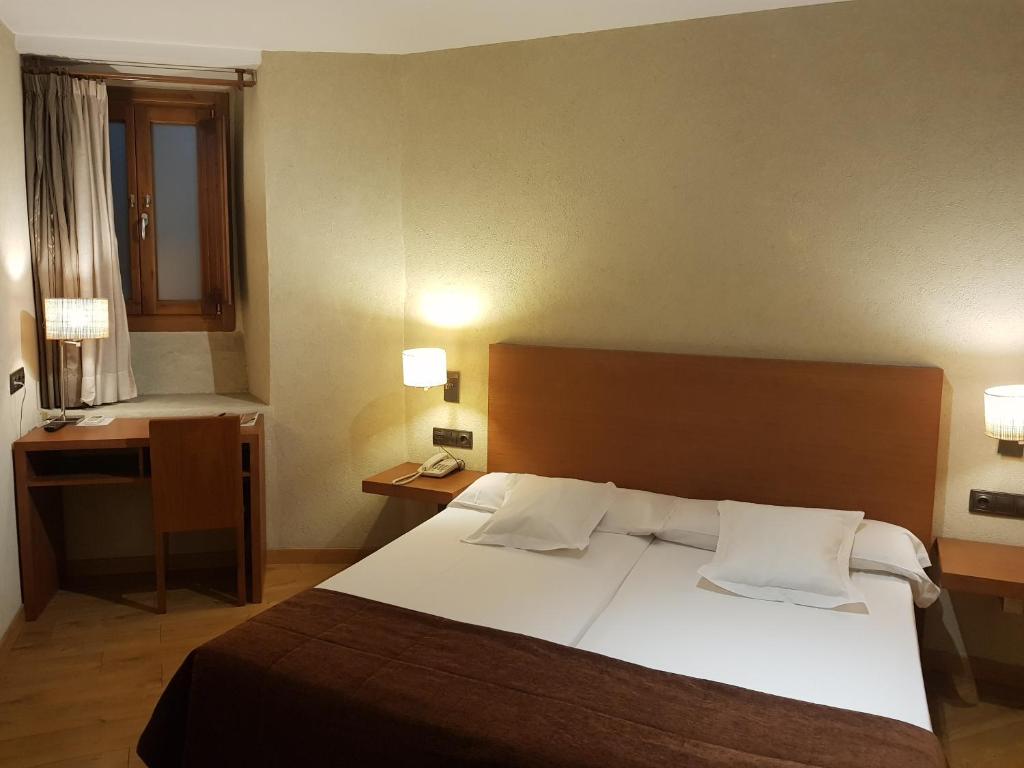 Postel nebo postele na pokoji v ubytování Hotel Las Leyendas
