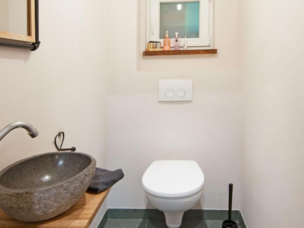 a bathroom with a sink and a toilet at Holiday Home between Spa and Eifel Nature Park in Xhoffraix