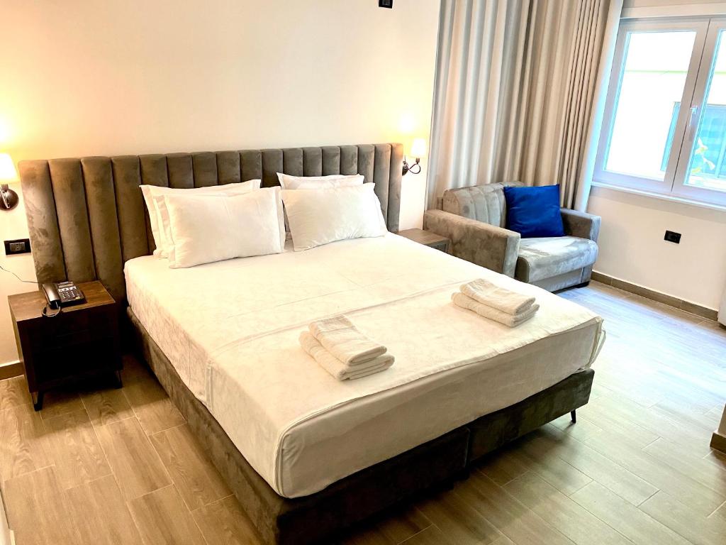 Postel nebo postele na pokoji v ubytování Venis Hotel