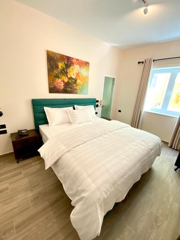 Postel nebo postele na pokoji v ubytování Venis Hotel
