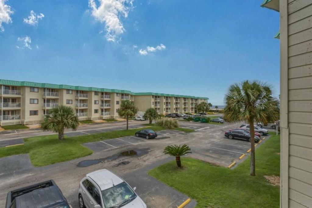a view of a parking lot in a apartment complex at Plantation East IV in Gulf Shores