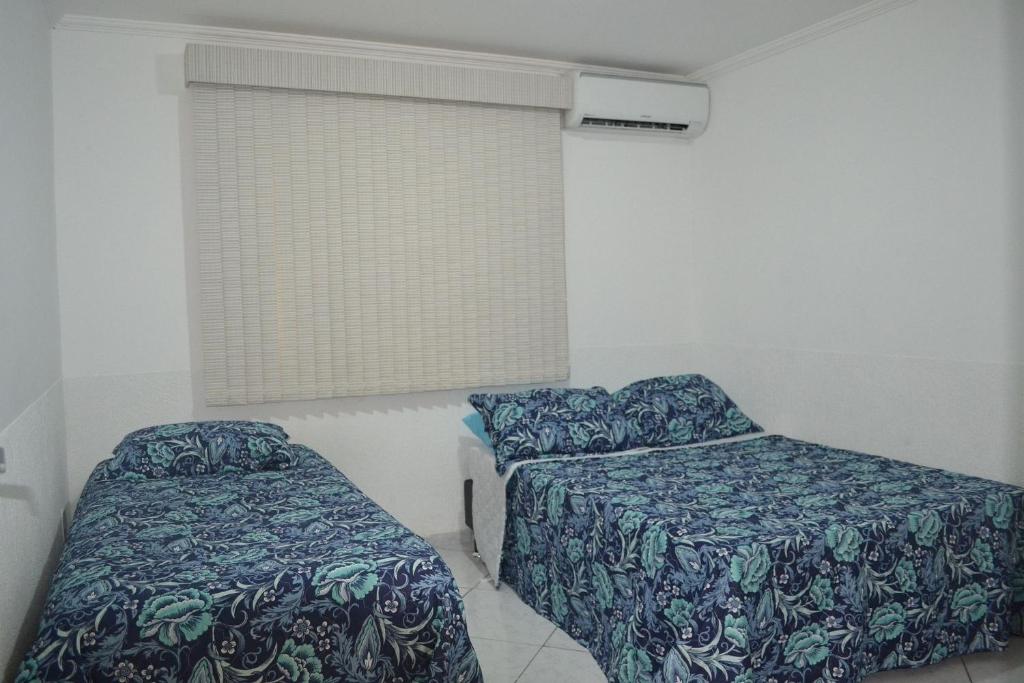  Casa com garagem e churrasqueira a 5 minutos da Praia Grande
