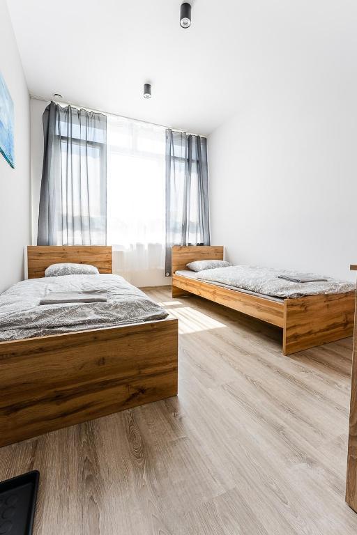 Posteľ alebo postele v izbe v ubytovaní Hostel Północna 61
