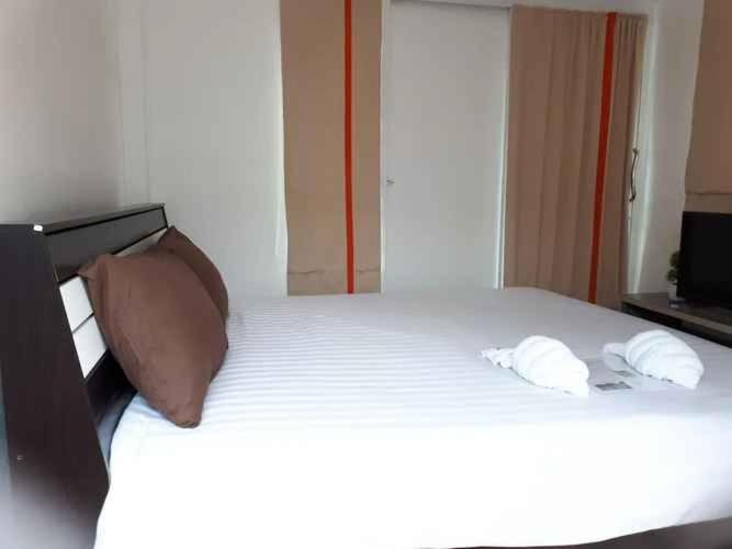 Postel nebo postele na pokoji v ubytování บ้านเล็ก รีสอร์ท