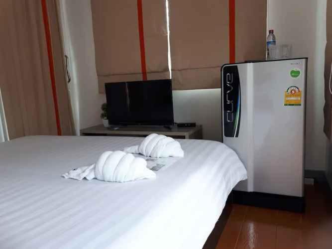 Postel nebo postele na pokoji v ubytování บ้านเล็ก รีสอร์ท