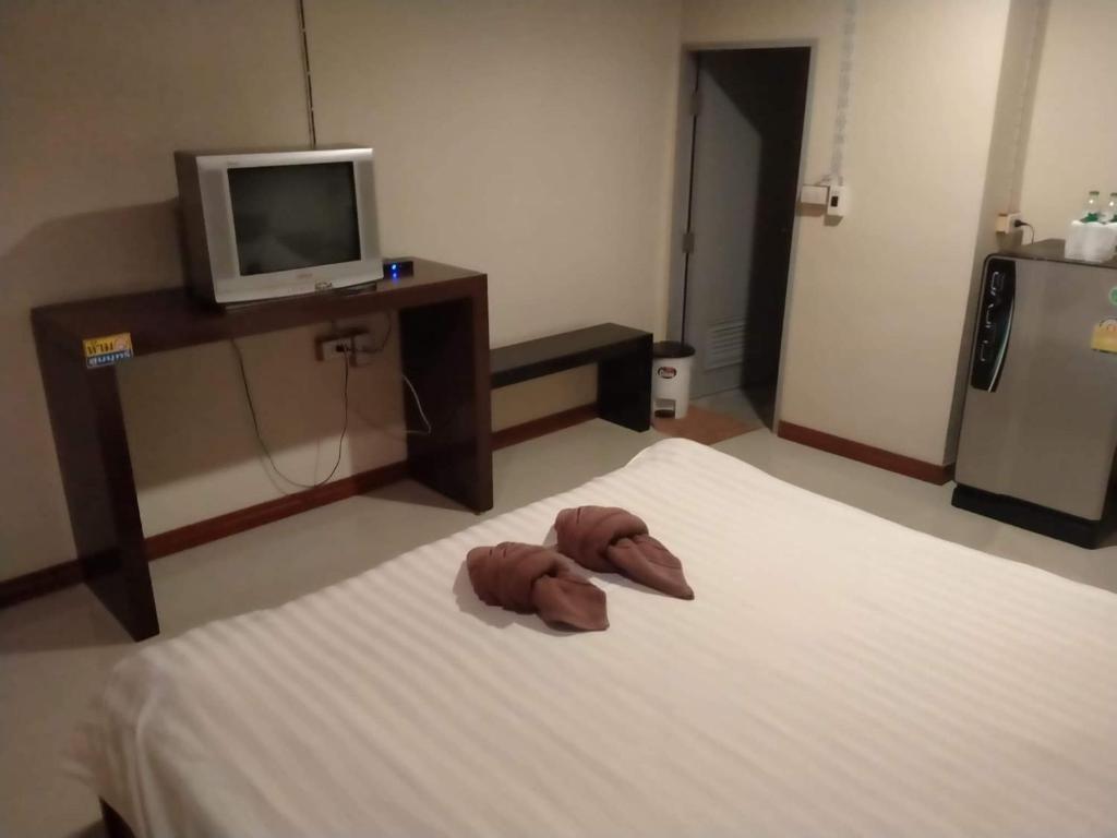 Postel nebo postele na pokoji v ubytování บ้านเล็ก รีสอร์ท