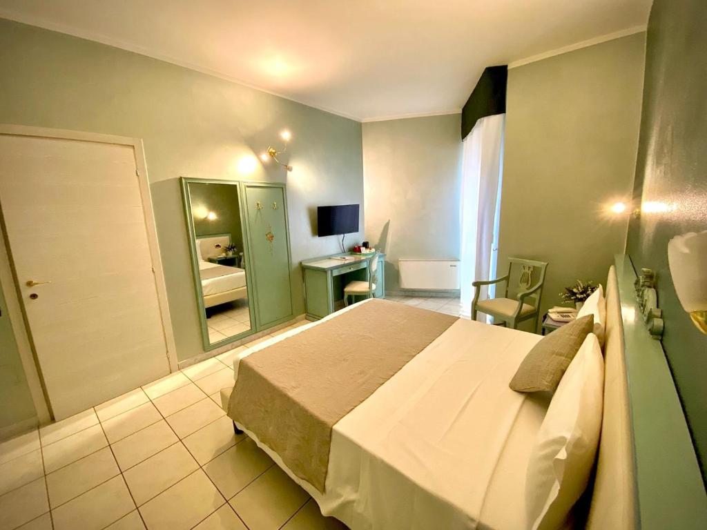 Postel nebo postele na pokoji v ubytování Piccolo Hotel Nogara