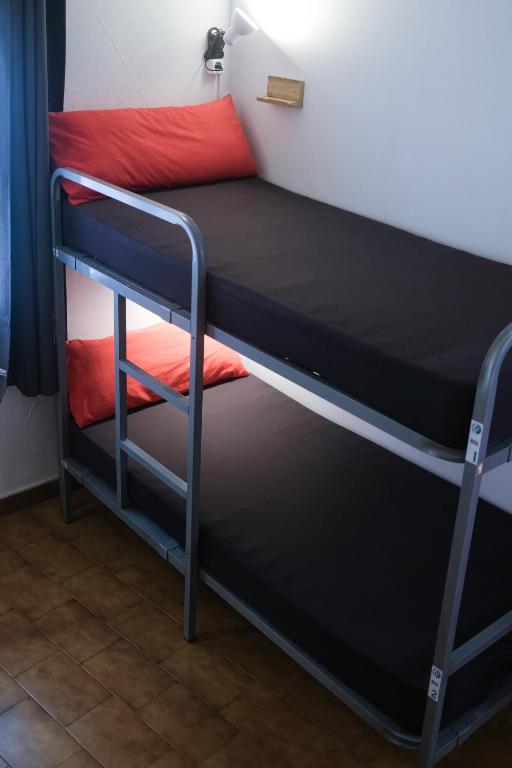 Postel nebo postele na pokoji v ubytování Mana Mana Youth Hostel
