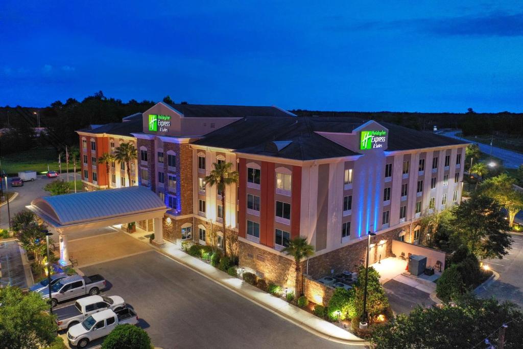 a large building with a clock on the front of it at Holiday Inn Express Hotel & Suites Mobile Saraland, an IHG Hotel in Saraland