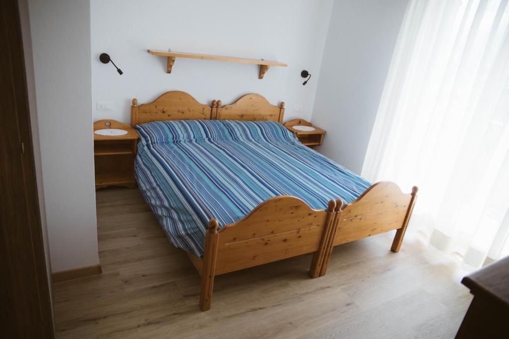 Posteľ alebo postele v izbe v ubytovaní Agritur Rizzi di Inama Ugo