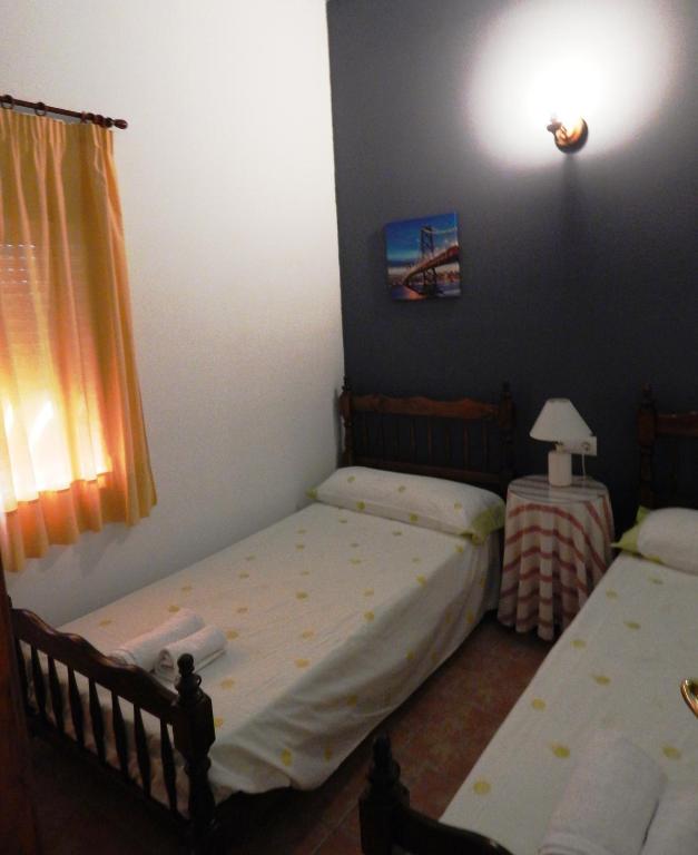 Postel nebo postele na pokoji v ubytování Villa María - Pista de Padel y Piscina
