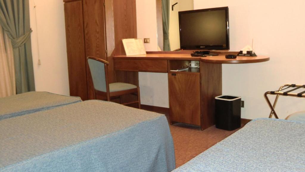 TV a/nebo společenská místnost v ubytování Hotel Giardino