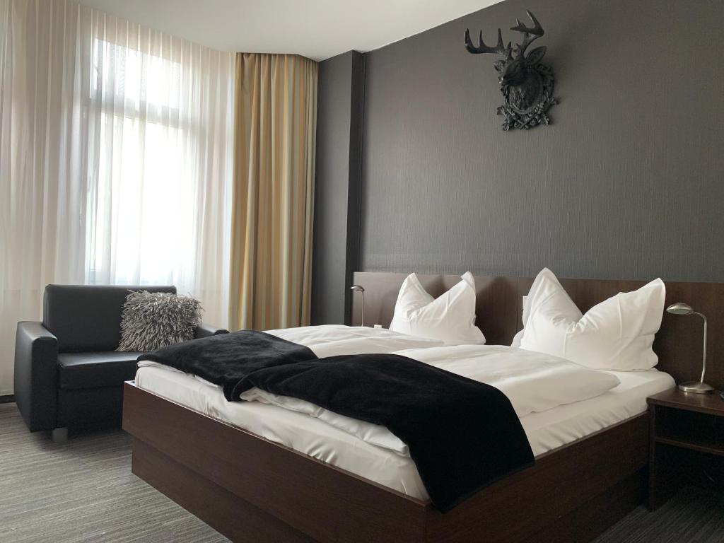 Postel nebo postele na pokoji v ubytování Hotel Lindenhof