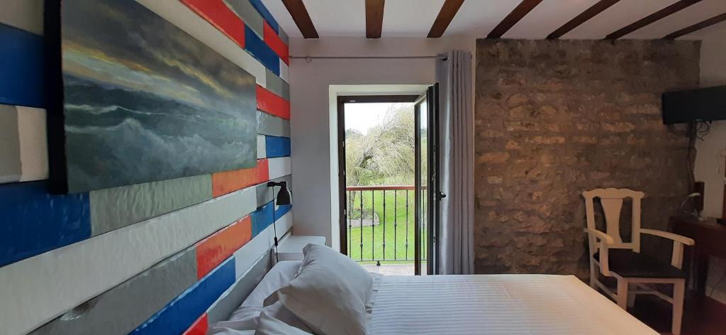 Cama o camas de una habitación en Posada Punta Liñera