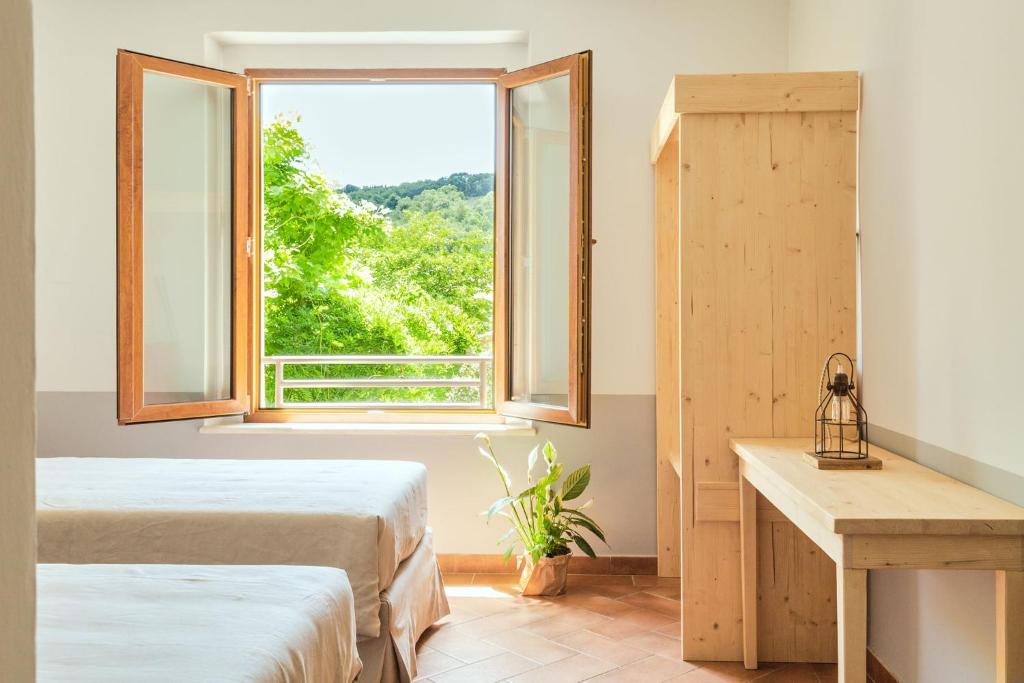 Postel nebo postele na pokoji v ubytování CUGUSI BnB