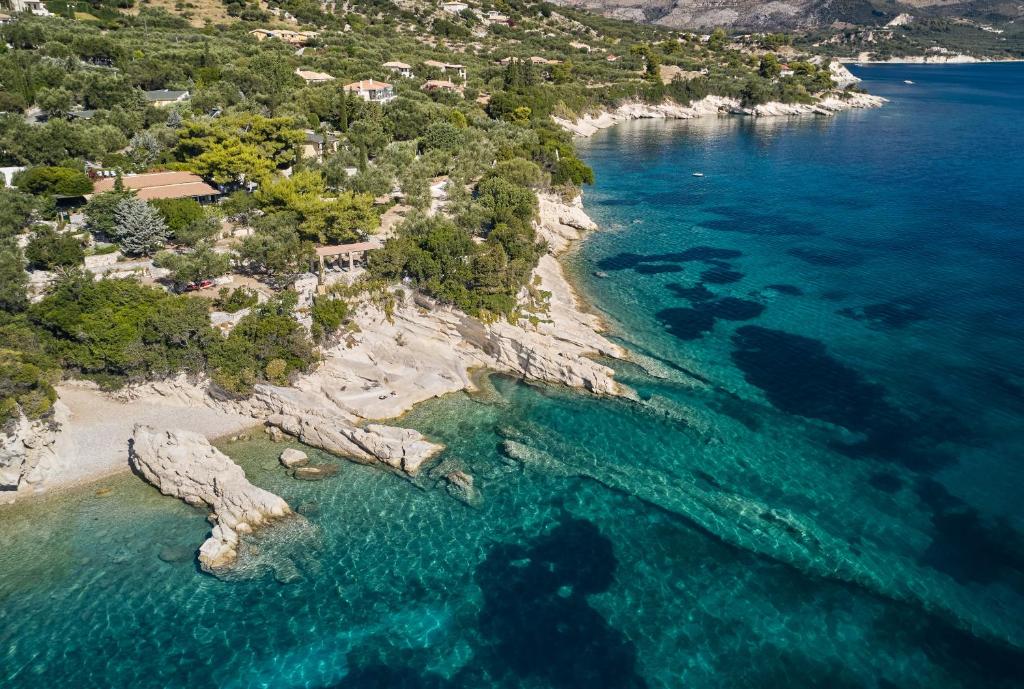 an aerial view of a rocky island in the ocean at Lithalona Villas & Houses in Marathias