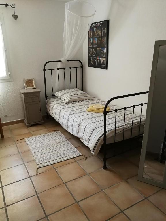 Postel nebo postele na pokoji v ubytování Appartements - Le Mas des Oliviers