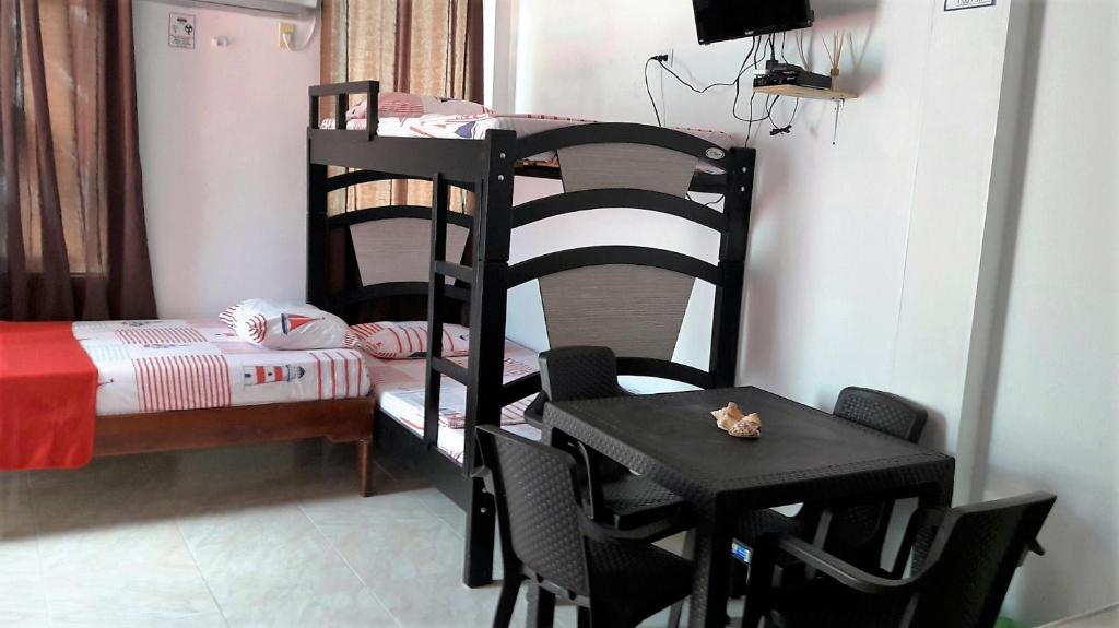 Postel nebo postele na pokoji v ubytování Posada Nativa Miss Zelzel Place