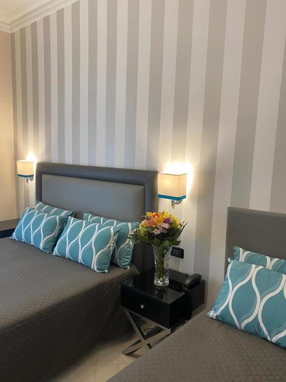 Postel nebo postele na pokoji v ubytování Hotel Contilia