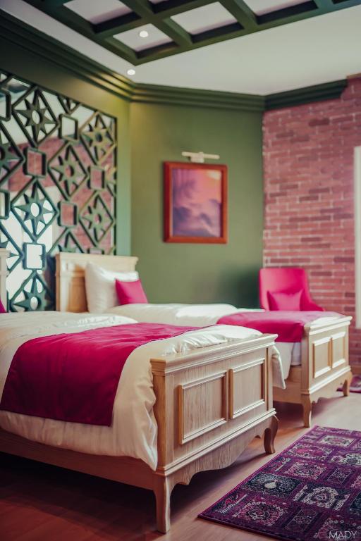 Postel nebo postele na pokoji v ubytování Miramar Boutique Hotel