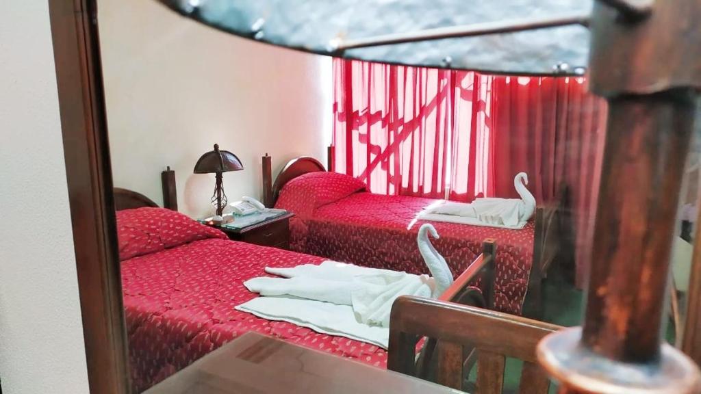 Postel nebo postele na pokoji v ubytování Hotel Alexander