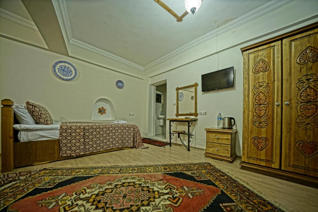TV a/nebo společenská místnost v ubytování Göreme Art Stone