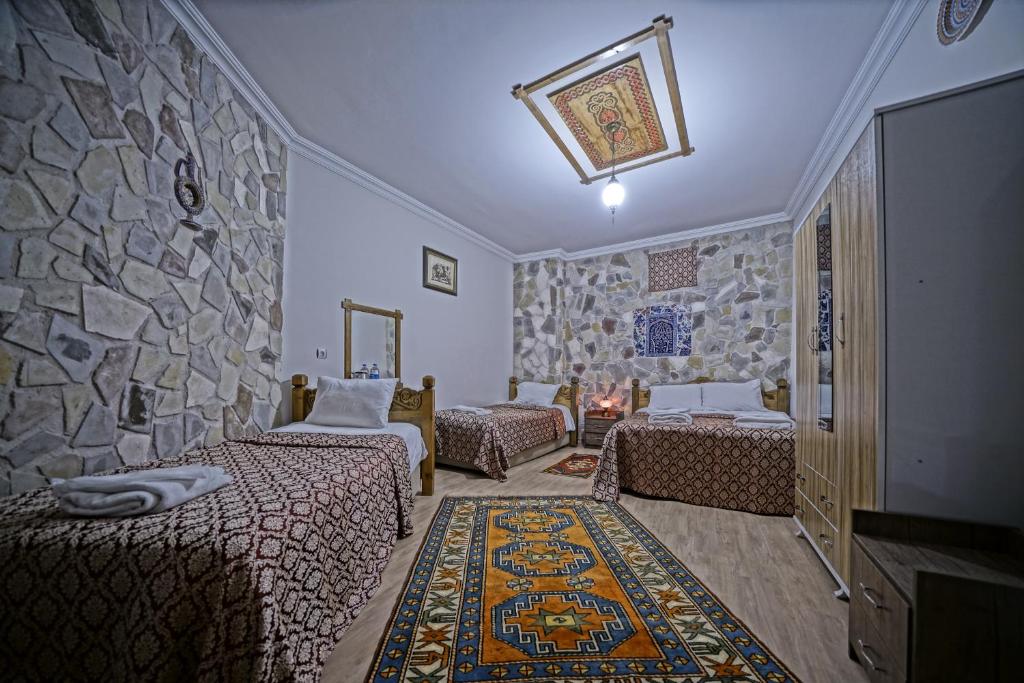 Postel nebo postele na pokoji v ubytování Göreme Art Stone