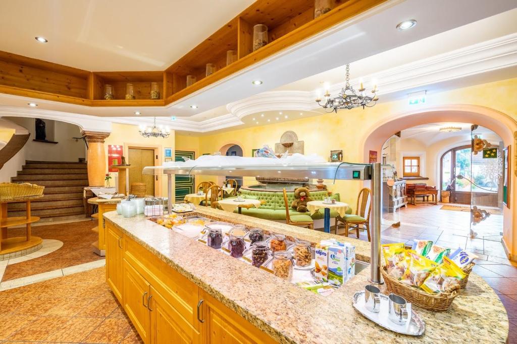 a kitchen with a large island in a room at Hotel Zum Schwarzen Bären in Emmersdorf an der Donau
