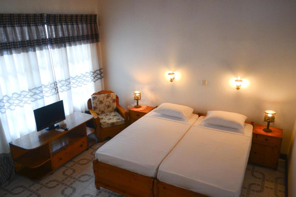Postel nebo postele na pokoji v ubytování Hotel Thai Lanka
