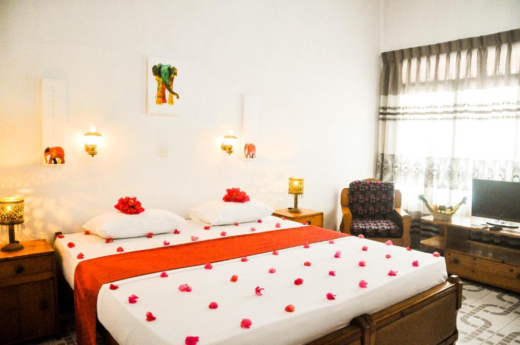 Postel nebo postele na pokoji v ubytování Hotel Thai Lanka