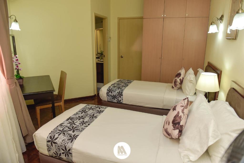 Postel nebo postele na pokoji v ubytování Lotus Desaru Beach Resort & Spa