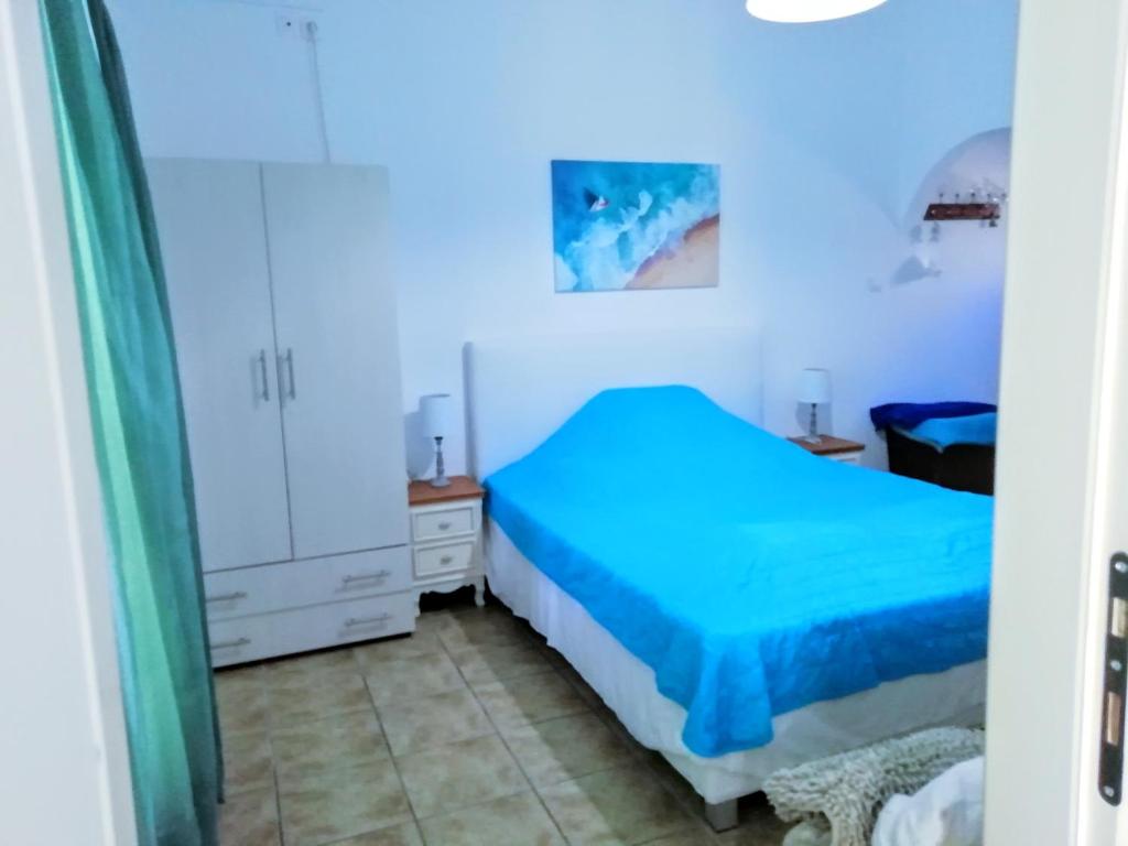 Postel nebo postele na pokoji v ubytování Logaras Seaview Apartment