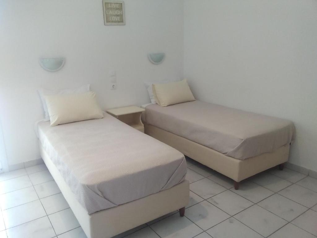 Postel nebo postele na pokoji v ubytování Gorgona apartments & studios