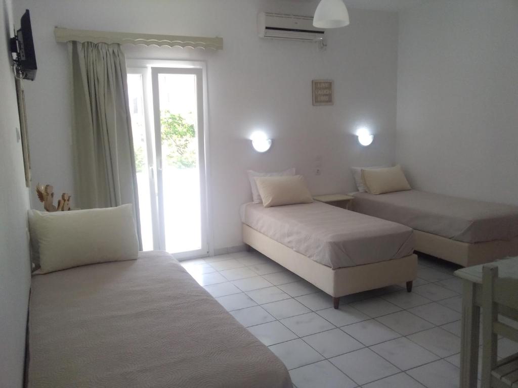 Postel nebo postele na pokoji v ubytování Gorgona apartments & studios