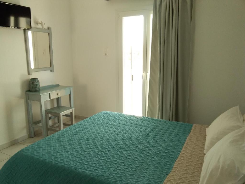 Postel nebo postele na pokoji v ubytování Gorgona apartments & studios