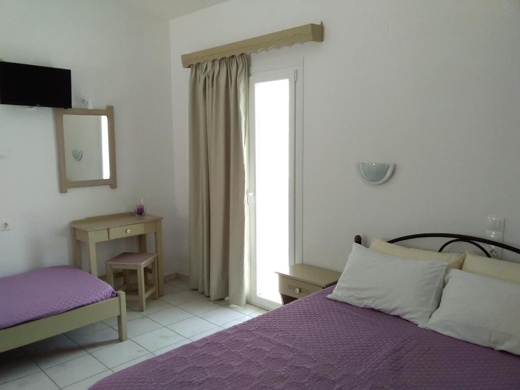 Postel nebo postele na pokoji v ubytování Gorgona apartments & studios