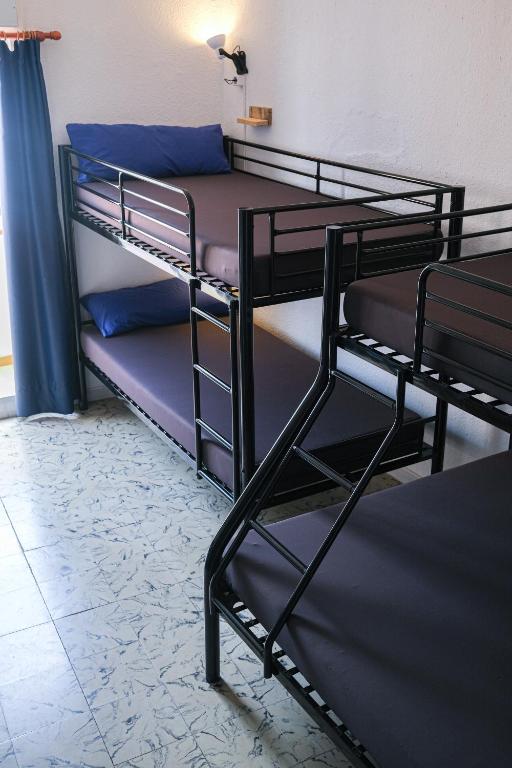 Postel nebo postele na pokoji v ubytování Mana Mana Youth Hostel