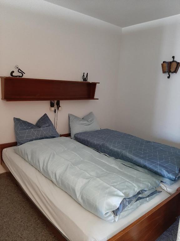 Postel nebo postele na pokoji v ubytování Haus Marmotta