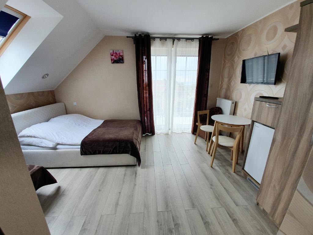 Posteľ alebo postele v izbe v ubytovaní Paradise