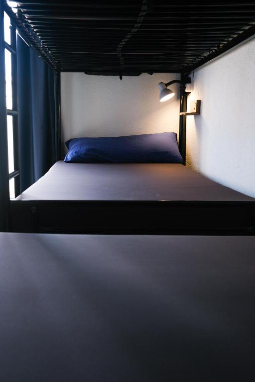 Postel nebo postele na pokoji v ubytování Mana Mana Youth Hostel