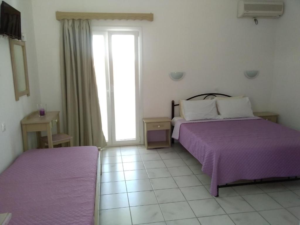 Postel nebo postele na pokoji v ubytování Gorgona apartments & studios